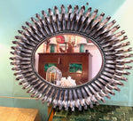 A Spanish 1960s silvered metal landscape or portrait oval eyelash mirror
