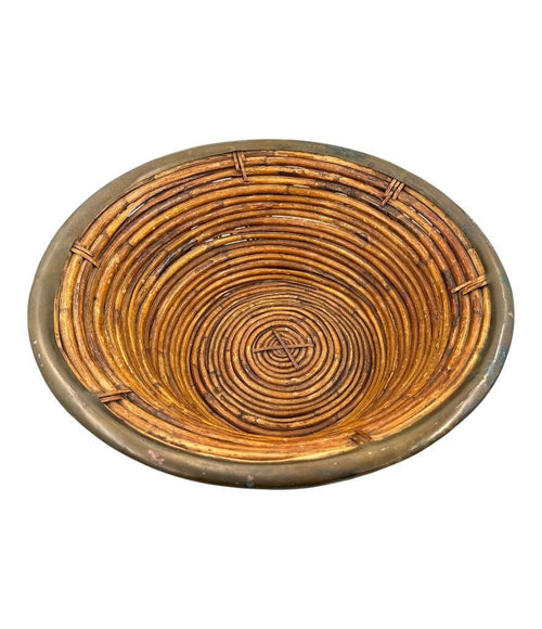 A large Italian 1970s woven bamboo bowl with brass rim