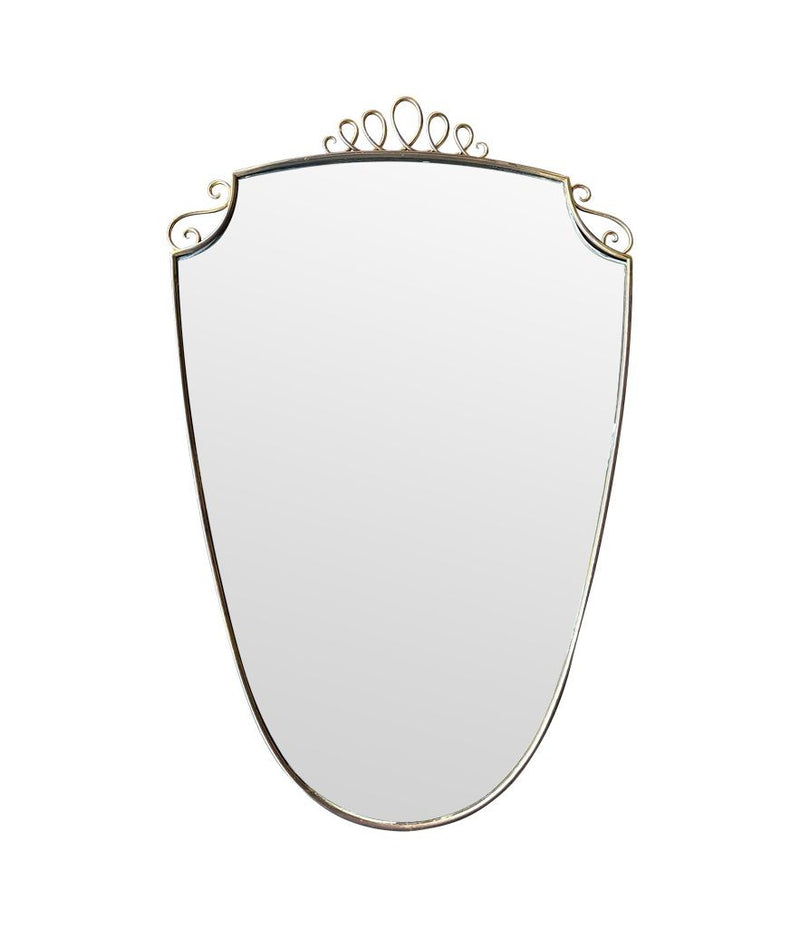 An orignal pair of 1950s Gio Ponti style Italian portrait brass framed mirror with brass top scroll detailing