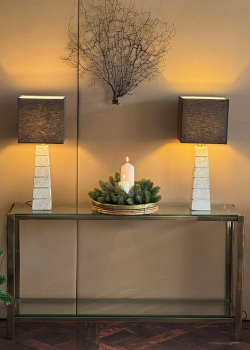 A 1970s Italian solid brass console table with 2 glass shelves