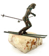 A large pair of bronze cast skiers by Curtis Jere mounted on onyx slabs