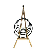 An unusual Italian 1950s mid century brass and black lacquered spiral magazine rack