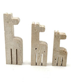 A set of three 1970s Fratelli Mannelli travertine giraffes