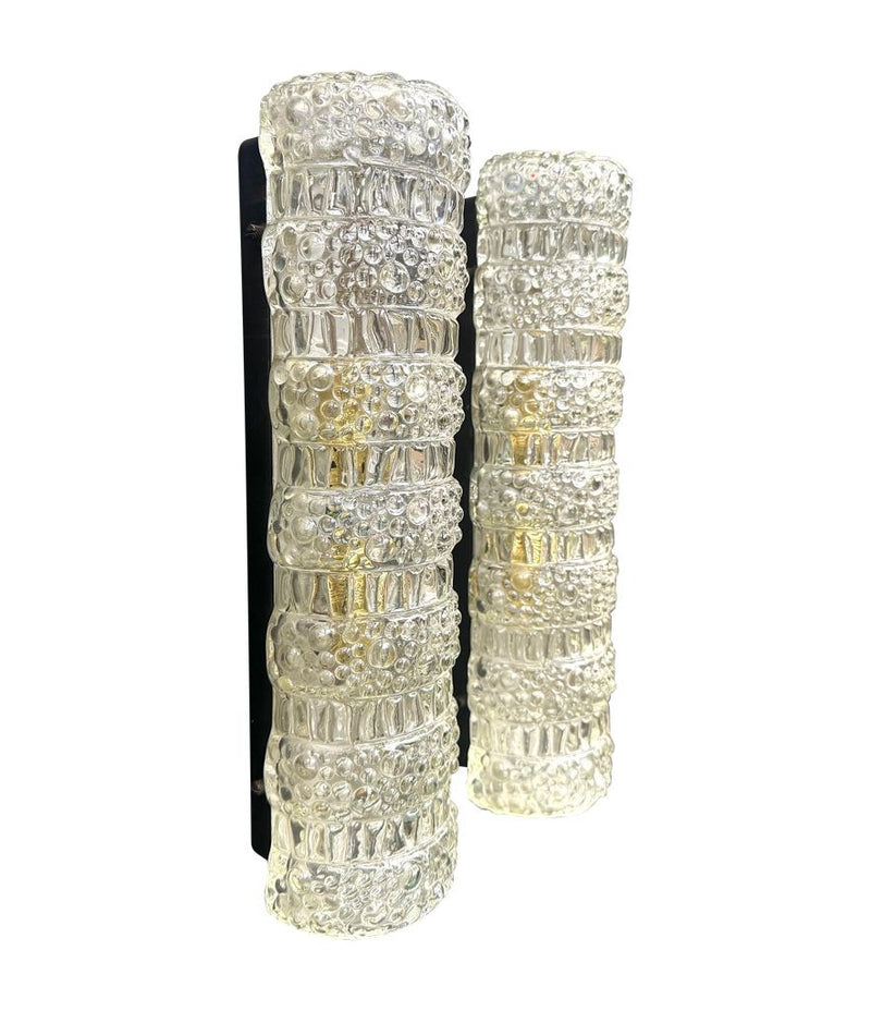A pair of 1960s clear geometric textured glass wall lights