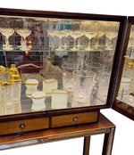 An Italian 1940s mirrored birdseye maple wood and mahogany bar cabinet by Osvaldo Borsani