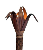 An unusual palm tree floor lamp with real palm trunk, wooden base and wooden shaped leaves