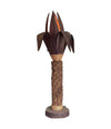 An unusual palm tree floor lamp with real palm trunk wooden base and wooden shaped leaves