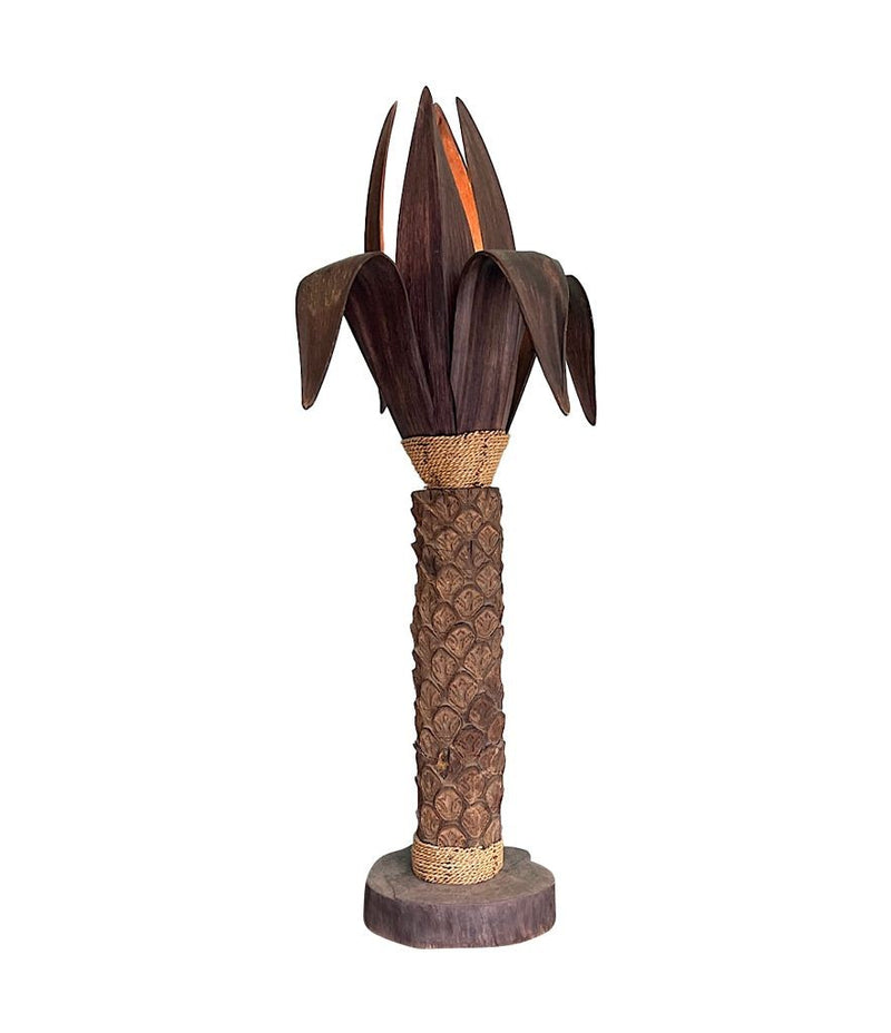 An unusual palm tree floor lamp with real palm trunk wooden base and wooden shaped leaves