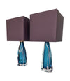 A pair of 1960s Orrefors turquoise glass and brass lamps with new bespoke linen shades