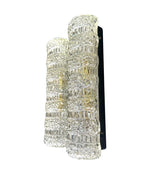 A pair of 1960s clear geometric textured glass wall lights