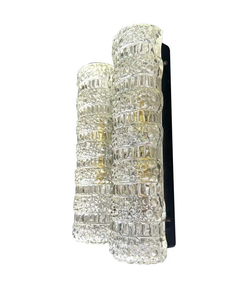 A pair of 1960s clear geometric textured glass wall lights
