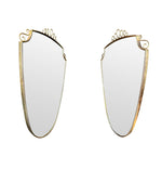 An orignal pair of 1950s Gio Ponti style Italian portrait brass framed mirror with brass top scroll detailing