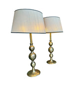 A pair of large Italian 1970s solid brass lamps with orignal satin shades