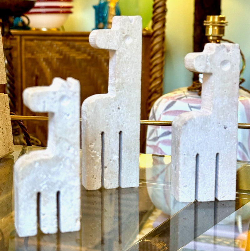 A set of three 1970s Fratelli Mannelli travertine giraffes