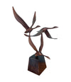 A French 1960s Mid century bronze sculpture by Lumiere of three flying swans mounted on a bronze base,