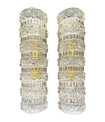 A pair of 1960s clear geometric textured glass wall lights