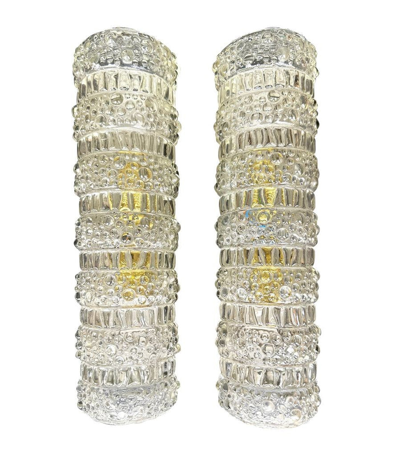 A pair of 1960s clear geometric textured glass wall lights