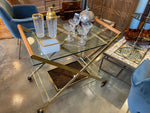 A 1980s Gallotti and Radice “Mister” bar trolley with brass frame and cherry wood handles.