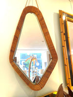 An unusual Italian 1950s diamond shaped woven rattan and brass framed mirror with leather hanging strap