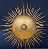 A pair of large 1950s Spanish sunburst wrought iron wall sconces