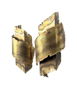A pair of Danish 1960s torch cut brass wall sconces by Holm Sorensen.