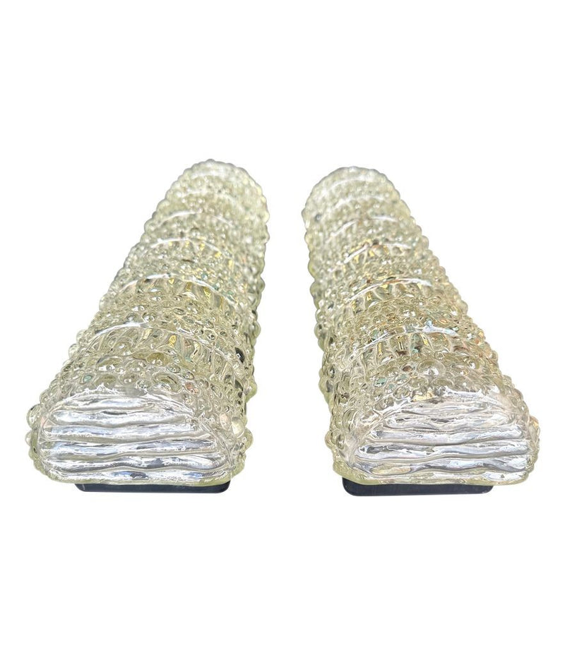 A pair of 1960s clear geometric textured glass wall lights