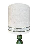 A large French 1960s green glazed ceramic lamp with original hessian shade