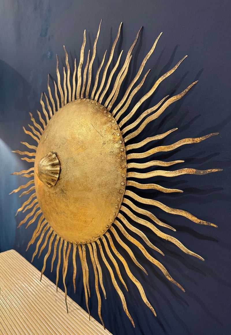 A pair of large 1950s Spanish sunburst wrought iron wall sconces