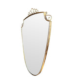 An orignal pair of 1950s Gio Ponti style Italian portrait brass framed mirror with brass top scroll detailing
