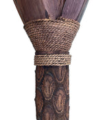 An unusual palm tree floor lamp with real palm trunk, wooden base and wooden shaped leaves