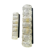 A pair of 1960s clear geometric textured glass wall lights