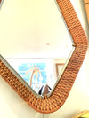 An unusual Italian 1950s diamond shaped woven rattan and brass framed mirror with leather hanging strap