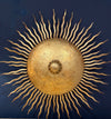 A pair of large 1950s Spanish sunburst wrought iron wall sconces