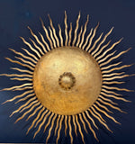 A pair of large 1950s Spanish sunburst wrought iron wall sconces