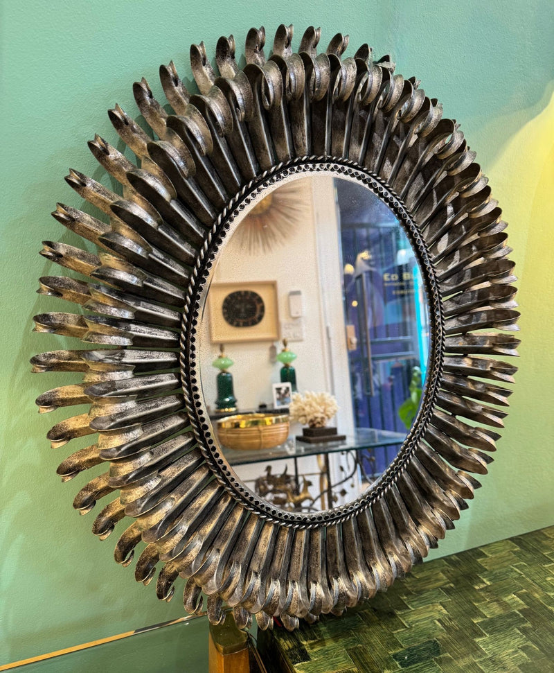 A Spanish 1960s silvered metal landscape or portrait oval eyelash mirror