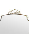 An orignal pair of 1950s Gio Ponti style Italian portrait brass framed mirror with brass top scroll detailing