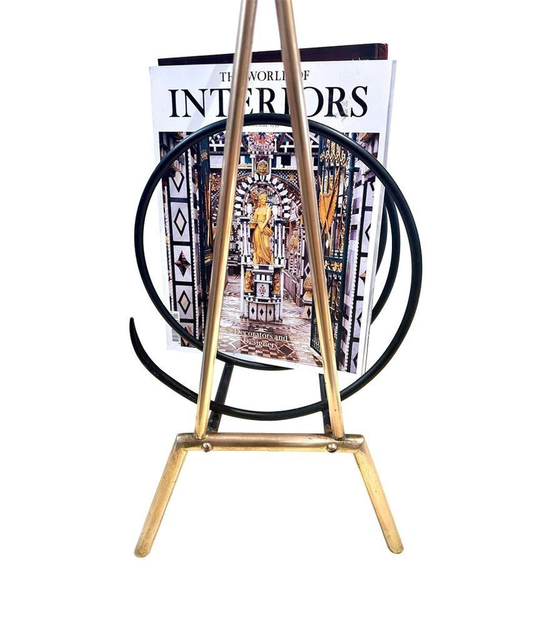 An unusual Italian 1950s mid century brass and black lacquered spiral magazine rack