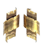 A pair of Danish 1960s torch cut brass wall sconces by Holm Sorensen.