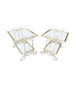 A pair of 1950s gilt wrought iron French side tables, with glass shelves