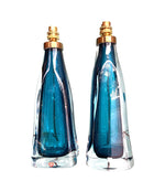 A pair of 1960s Orrefors turquoise glass and brass lamps with new bespoke linen shades