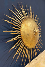 A pair of large 1950s Spanish sunburst wrought iron wall sconces