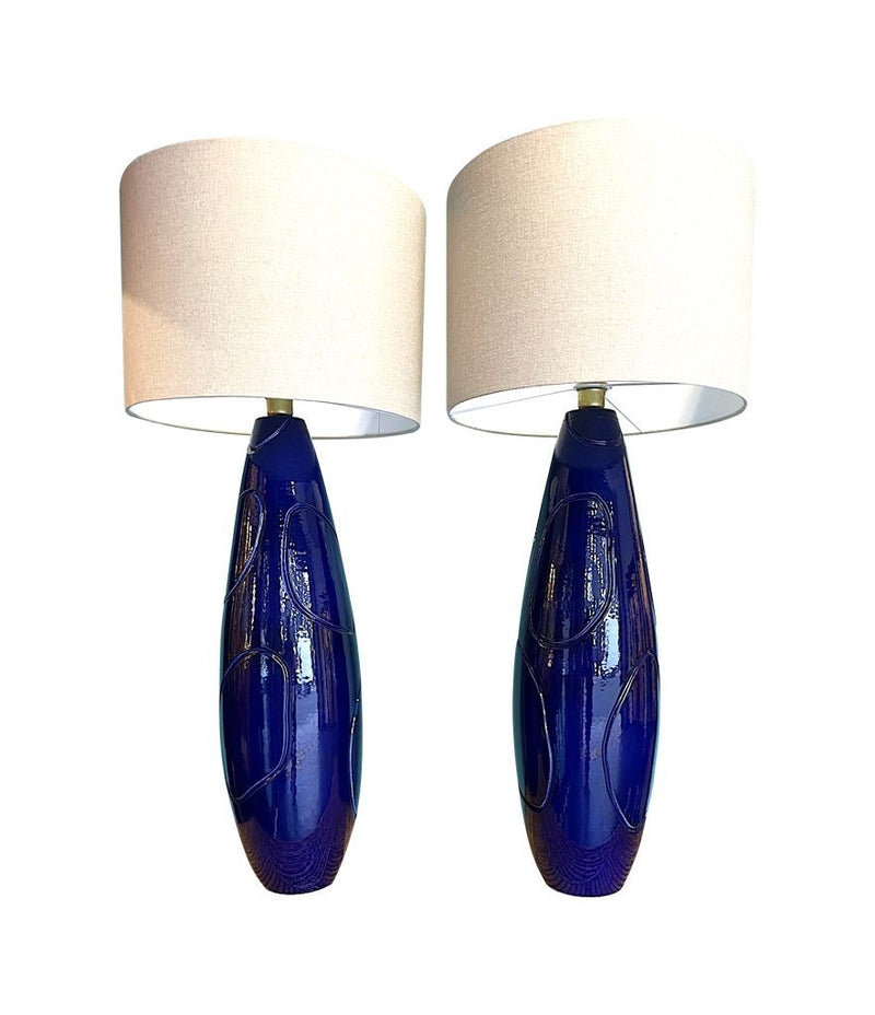 A pair of Italian 1980s large blue ceramic and brass lamps, rewired with with new fittings and linen shades