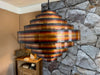 A 1960s Danish torch cut copper pendant light by Svend Aage Holm Sorensen