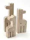 A set of three 1970s Fratelli Mannelli travertine giraffes