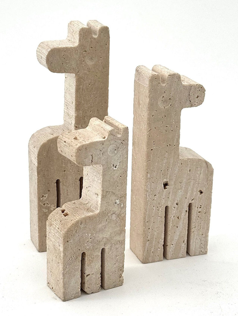 A set of three 1970s Fratelli Mannelli travertine giraffes