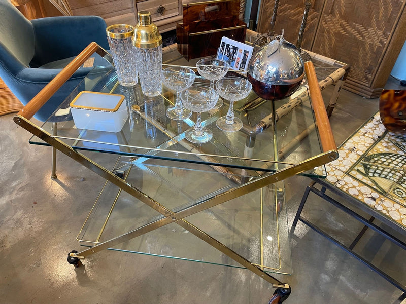 A 1980s Gallotti and Radice “Mister” bar trolley with brass frame and cherry wood handles.