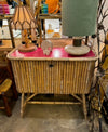 An Italian 1960s bamboo bar cabinet with red laminate top and two stools