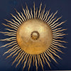 A pair of large 1950s Spanish sunburst wrought iron wall sconces