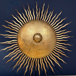 A pair of large 1950s Spanish sunburst wrought iron wall sconces