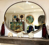 A large orignal Italian 1960s oval brass framed mirror